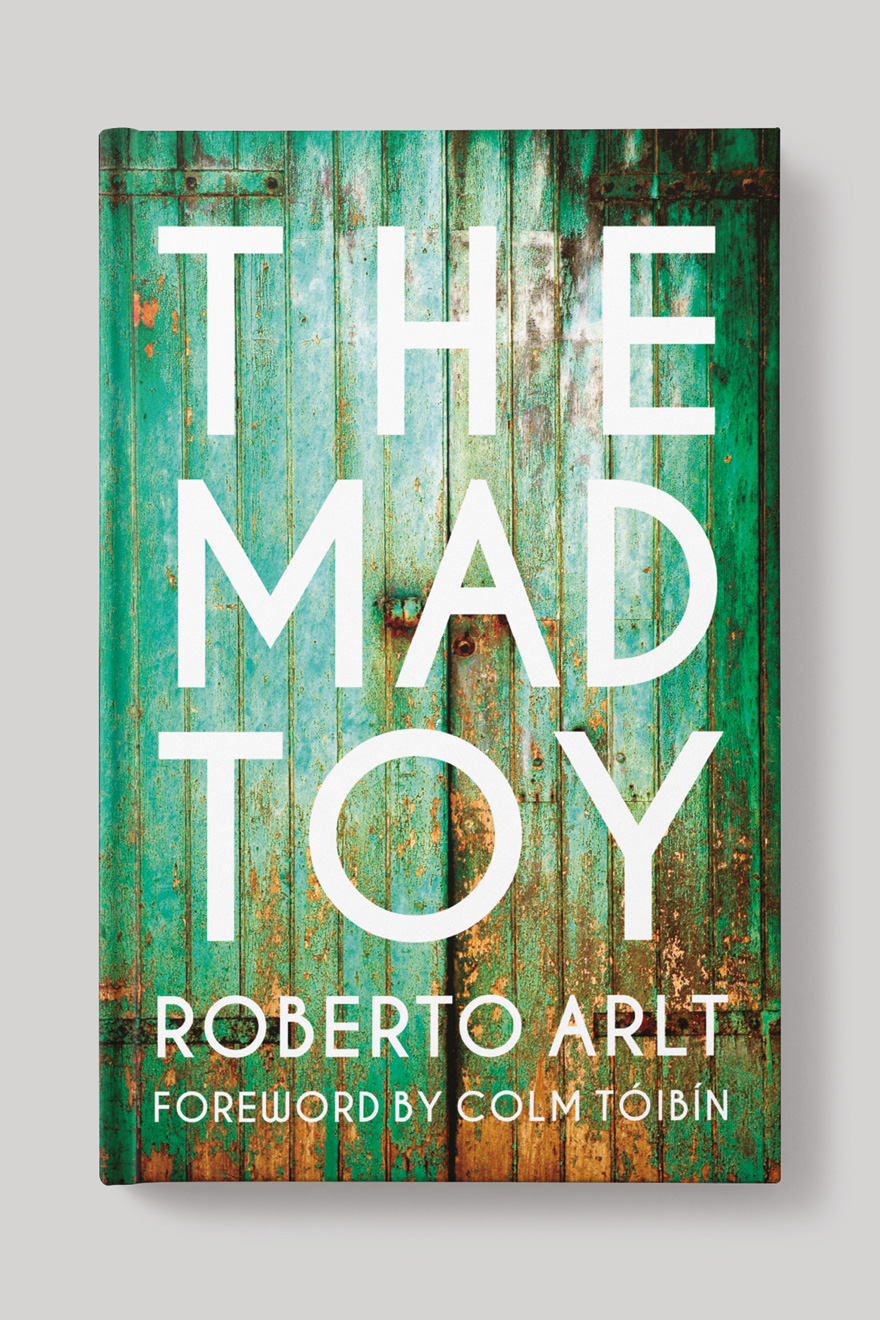 Front of the book cover to The Mad Toy, showing the title in large text agains a green, distressed wooden door