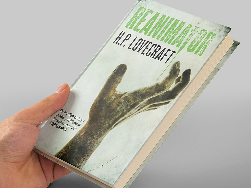 A hand holding a copy of the Hesperus Press edition of H.P. Lovecraft's Reanimator novel with the front cover designed by Roland Codd